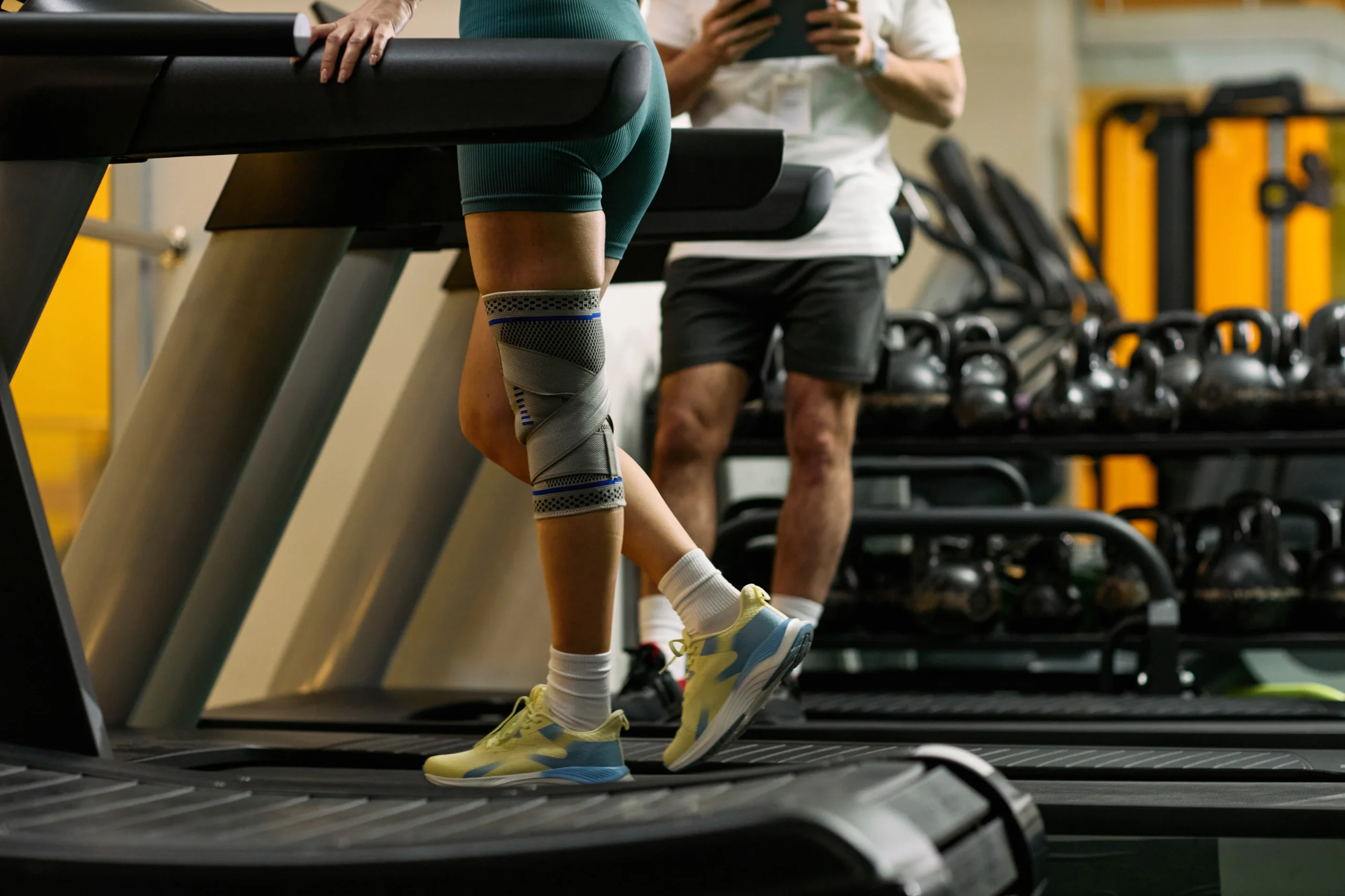 Physical therapist helping patient